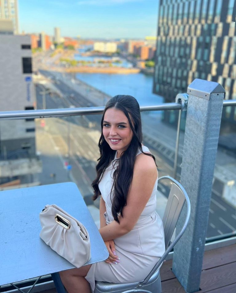 Emily sitting on balcony 