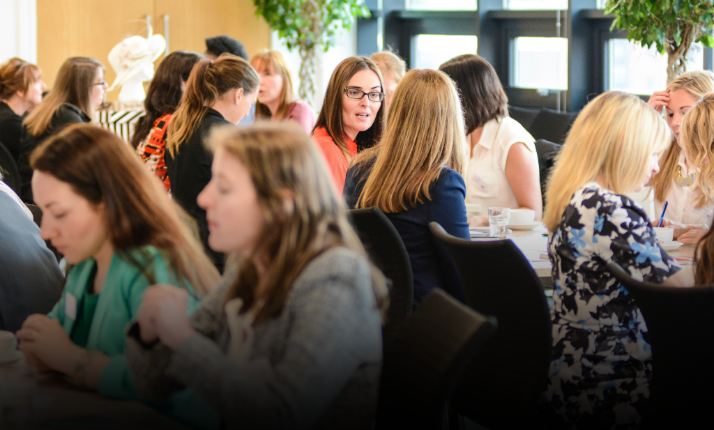 Women talking at a conference